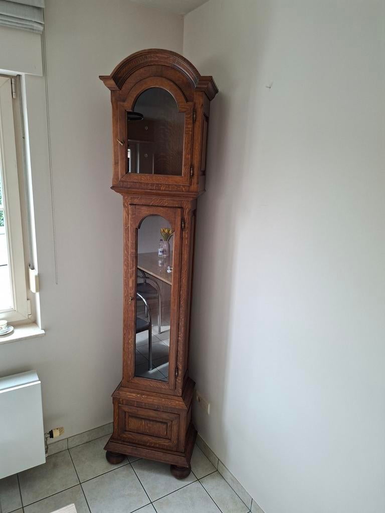 Massief eiken klokken kast, Ophalen