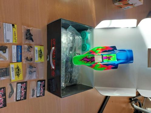 Rc Kyosho gloednieuwe Optima Mid, Hobby en Vrije tijd, Modelbouw | Radiografisch | Auto's, Nieuw, Auto offroad, Elektro, Schaal 1:10