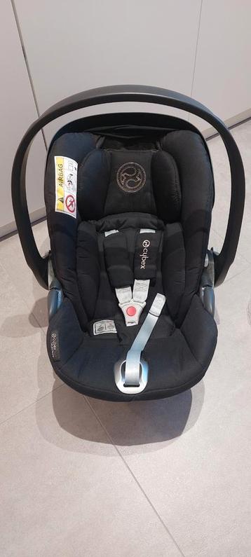 Maxicosy cybex + base isofix + protection pluie  disponible aux enchères