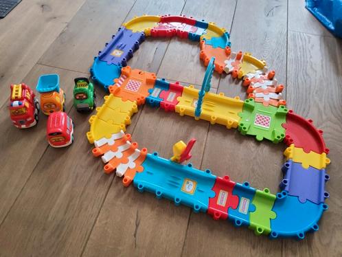 Circuit Vtech Tut Tut Bolides + 4 auto's Nieuwprijs 22,99e, Kinderen en Baby's, Speelgoed | Vtech, Zo goed als nieuw, Ophalen of Verzenden