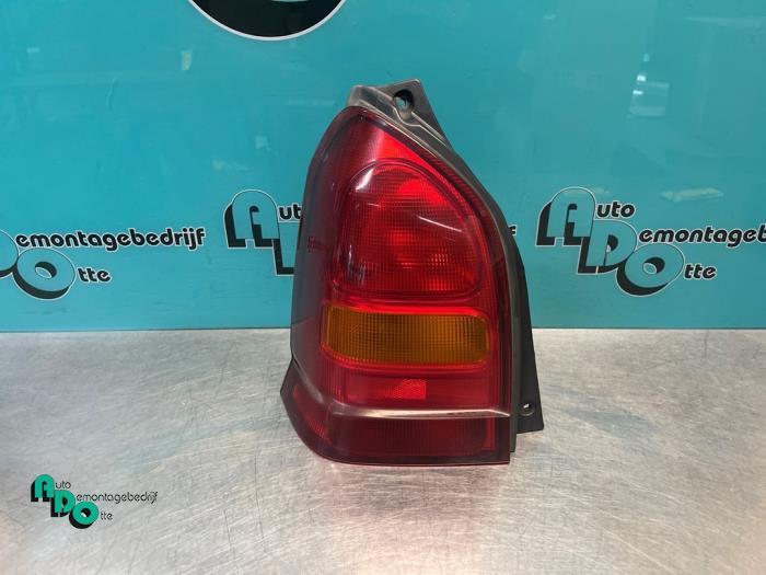 Feu arrière gauche d'un Suzuki Alto (Alto 02-), Autos : Pièces & Accessoires, Éclairage, Suzuki, Utilisé, 3 mois de garantie, Enlèvement ou Envoi
