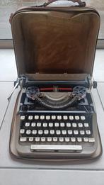 Machine à écrire ancienne avec étui en cuir, Enlèvement