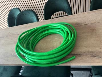 Groene tuinslang  beschikbaar voor biedingen