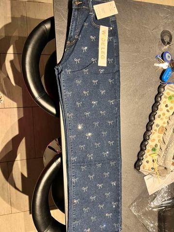 Mooie blauwe spijkerbroek strassstrikken aan de voorkant T42 beschikbaar voor biedingen