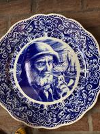 Delfs blauw bord, Ophalen