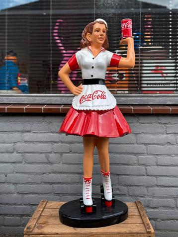 Groot Coca Cola reclame beeld beschikbaar voor biedingen