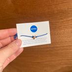 Bracelet ajustable en forme d'étoile dorée, Neuf, Enlèvement ou Envoi, Avec bracelets à breloques ou perles, Autres matériaux