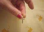 ring met kruisje, Ophalen