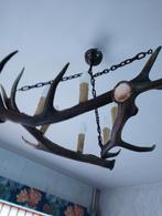 Lustre en bois de cerfs, Ophalen