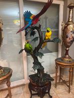 Grote bronzen papegaaien  in een boom, Ophalen
