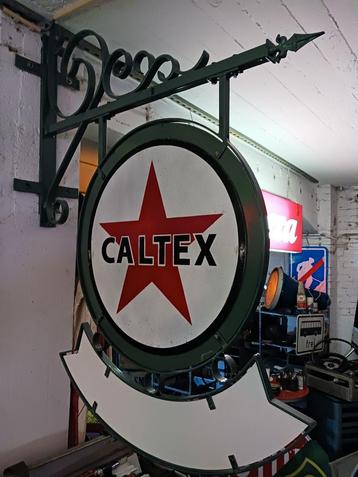 Signe Caltex. disponible aux enchères