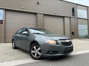 CHEVROLET CRUZE/1.6i/2010/TREKHAAK/PDC/AIRCO/EURO5 disponible aux enchères