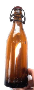 bierfles met opdruk in glas "Alken" - 33 cl, Bouteille(s), Utilisé, Enlèvement ou Envoi