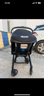 De zwarte kinderwagen Doona met stoelverhoger de wieldoppen, Kinderen en Baby's, Ophalen, Zo goed als nieuw, Kinderwagen