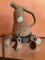 Karaf + alcoholbekers, Ophalen