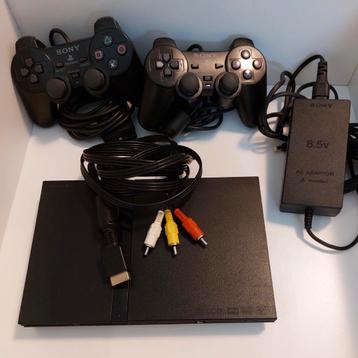 PlayStation 2 avec 2 manettes et 8 jeux