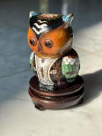Uil in cloisonné, Ophalen