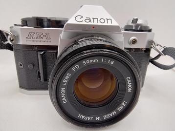 Canon AE1 Program met Canon Fd 50mm 1:1.8 lens en draagriem disponible aux enchères