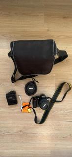 Nikon D3100-pakket + 2 lenzen + accessoires, Audio, Tv en Foto, Ophalen of Verzenden, Zo goed als nieuw