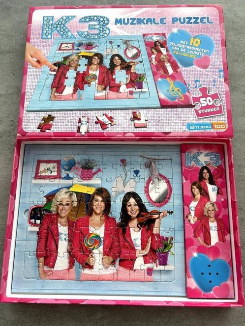 Studio 100, Muzikale K3 puzzel 50 stuks, Kinderen en Baby's, Speelgoed | Kinderpuzzels, Zo goed als nieuw, 2 tot 4 jaar, 10 tot 50 stukjes