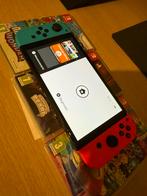 Nintendo Switch OLED (Neon Red/Blue) bundel, Games en Spelcomputers, Spelcomputers | Overige, Ophalen of Verzenden, Zo goed als nieuw