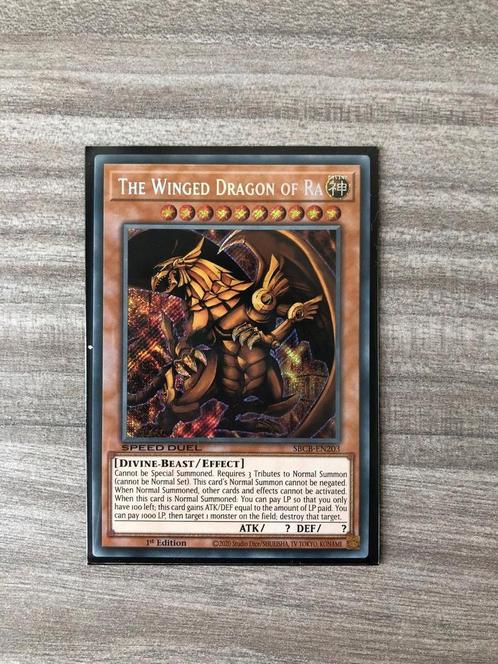 The Winged Dragon of Ra (SBCB-EN203), Hobby en Vrije tijd, Verzamelkaartspellen | Yu-gi-Oh!, Zo goed als nieuw, Losse kaart, Foil