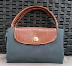 Longchamps tasje, Ophalen