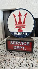 Maserati bord namaak met licht, Ophalen