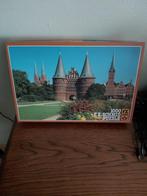 F.X.Schmid Puzzle van 1000 stukjes Holstenpoort,Lûbeck, Hobby en Vrije tijd, Ophalen of Verzenden, 500 t/m 1500 stukjes, Zo goed als nieuw