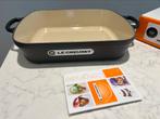 Nieuwe gietijzeren Le Creuset ovenschaal van 33 cm, Gietijzer, Nieuw, Ophalen of Verzenden, Keramische plaat