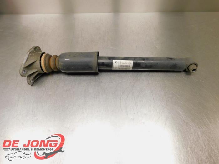 Schokdemper links-achter van een BMW 1-Serie, Auto-onderdelen, Ophanging en Onderstel, BMW, Gebruikt, 3 maanden garantie, Ophalen of Verzenden