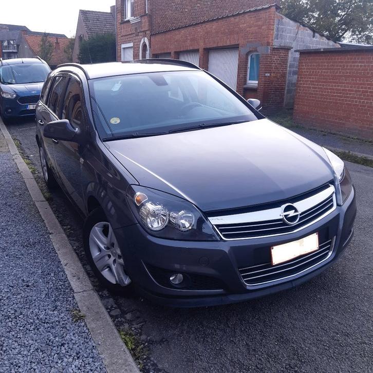 Opel break enjoy 2010 1.6 essence, Auto's, Opel, Particulier, Astra, Airbags, Airconditioning, Cruise Control, Metaalkleur, Radio