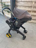 Doona met isofix en accessoires, Ophalen, Zo goed als nieuw, Regenhoes