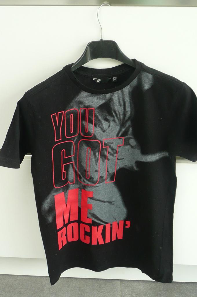 Zwarte T-shirt WE (K421), Kinderen en Baby's, Kinderkleding | Maat 146, WE, Ophalen of Verzenden, Zo goed als nieuw, Shirt of Longsleeve