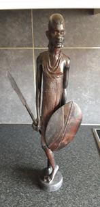 Houten Afrikaans beeld, Ophalen