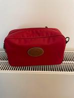 Toilettas Longchamp, Ophalen