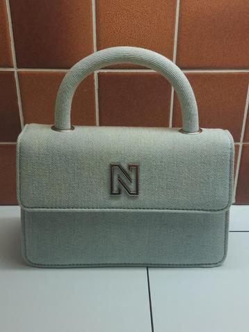 Handtas Nikkie, in de hand te dragen of met schouderlint., Enlèvement ou Envoi, Comme neuf, Sac à main