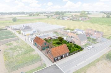 Te renoveren woning met ruime opslagruimte, tuin én landbouw beschikbaar voor biedingen