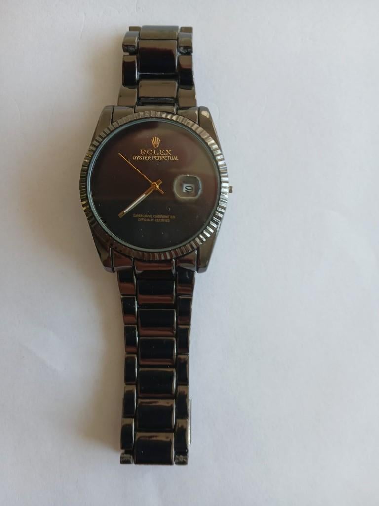 Prachtig horloge uurwerk ROLEX zwart/goud ,wieltje ontbreekt, Staal, Gebruikt, Polshorloge, Ophalen of Verzenden