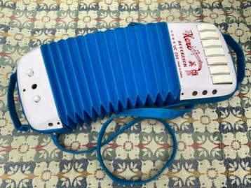Vintage instrumenten : zither, knopaccordeon, mondaccordeon beschikbaar voor biedingen