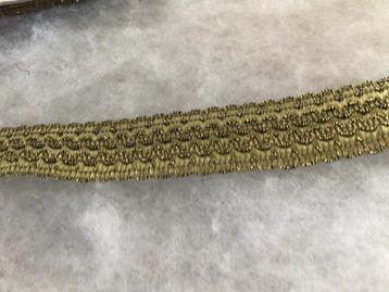 Vintage afboordlint. Brons/goud. H 2,7 cm. Nieuw beschikbaar voor biedingen