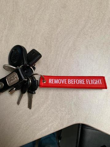 Sleutelhanger remove before flight beschikbaar voor biedingen