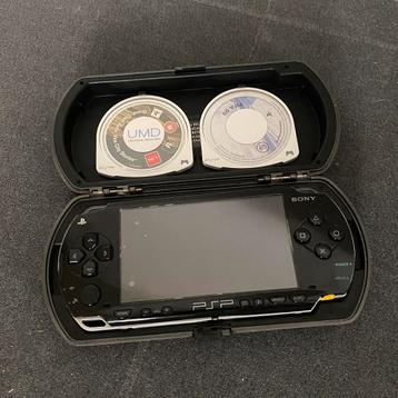 Sony PSP + 2 games + case