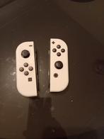 2 witte Nintendo Switch-controllers, Ophalen