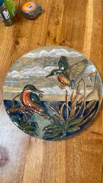 bord met ijsvogels, Ophalen