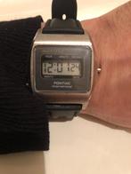 Horloge vintage pontiac international lcd, Handtassen en Accessoires, Overige merken, Staal, Gebruikt, Ophalen of Verzenden