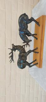 Bronzen herten, Ophalen
