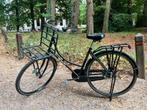 Retro fiets met bagagerek vooraan, Ophalen