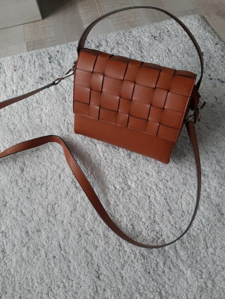 Schoudertas, Ophalen, Handtas