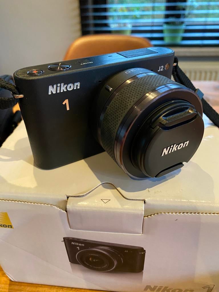 Nikon 1 J2 toestel met Nikkor 10-30mm lens, Audio, Tv en Foto, Fotocamera's Digitaal, Ophalen, Zo goed als nieuw, Nikon